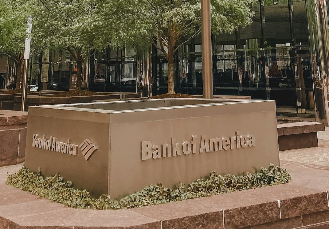 Bank of America branch exterior with corporate signage in an urban financial district.