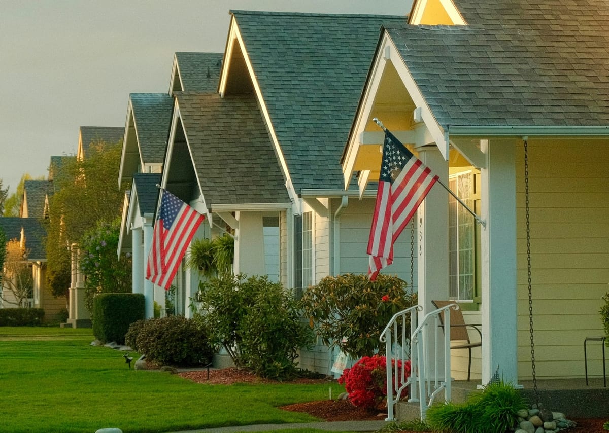 U.S. single-family homes and for-sale signs as markets react to proposed limits on institutional housing investors.