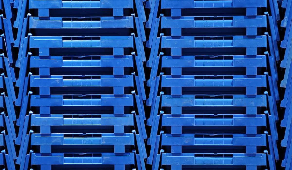 Advanced Micro Devices (AMD) and Meta (META) logos displayed alongside AI data center server racks, reflecting the multiyear AI chip supply agreement.