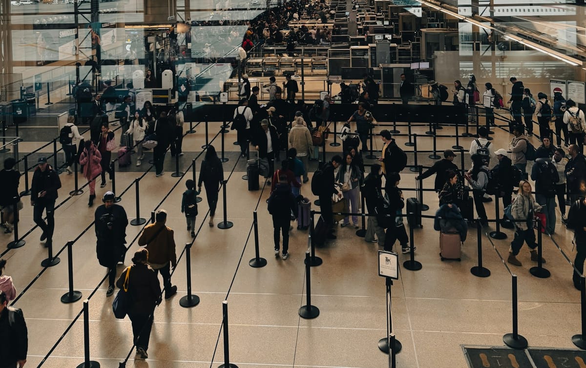 Long security lines at a major U.S. airport as airlines face rising oil prices and government shutdown disruptions.