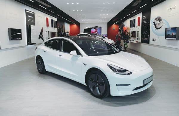 Tesla vehicles at a showroom center amid broader shifts in the global electric vehicle market.