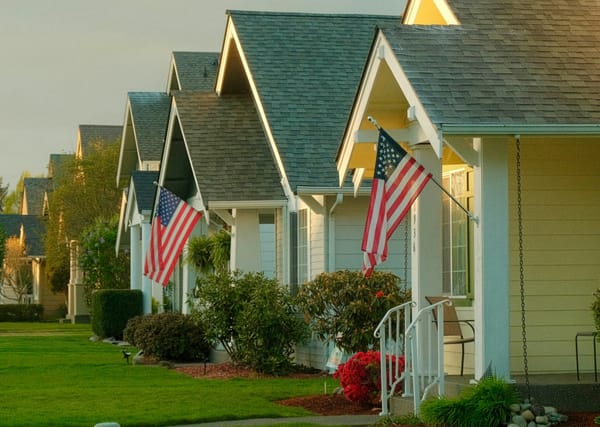 U.S. single-family homes and for-sale signs as markets react to proposed limits on institutional housing investors.