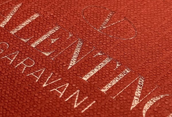 Fashion designer Valentino Garavani name printed on hand bag, representing his legacy in global luxury fashion.