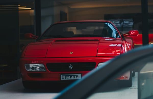 Ferrari used car displayed, representing online used-car retailer CVNA earnings report and stock reaction.